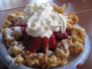 Funnel Cake with Strawberry topping and Whipped Cream
