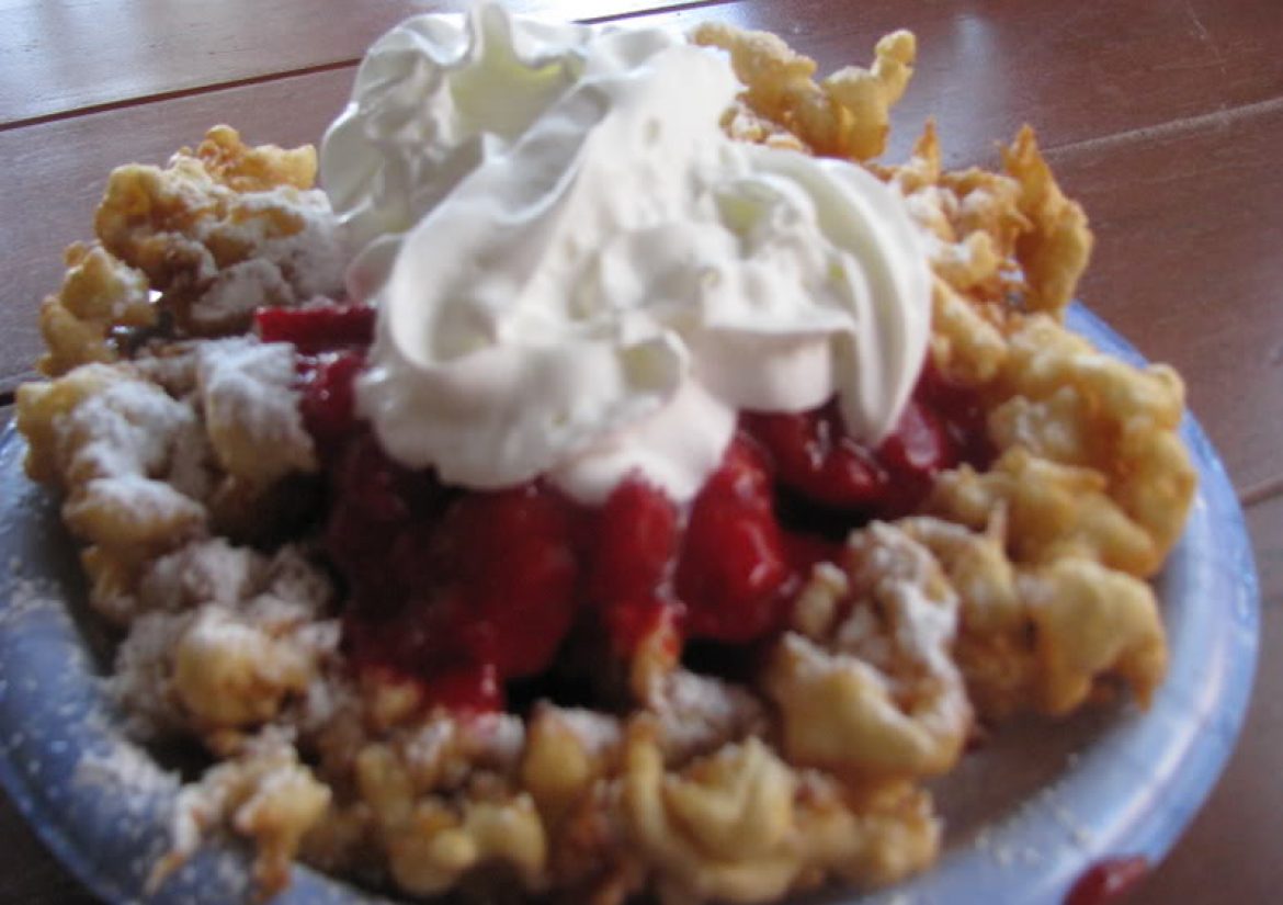 Funnel Cake with Strawberry topping and Whipped Cream